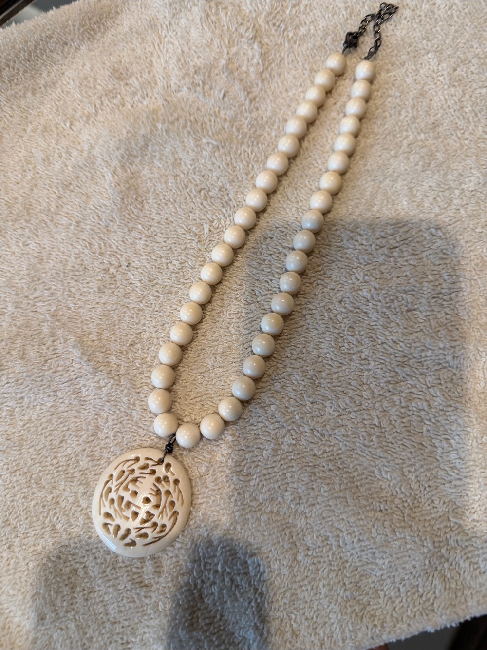 Cream Beaded Necklace with Carved Floral Pendant